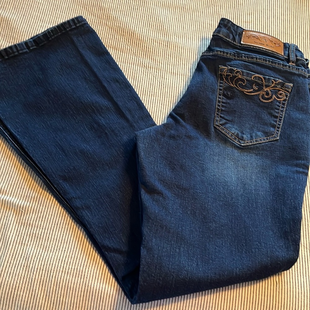 Like new dark blue denim by Suzanne Petro. There is a size 10 or 12.